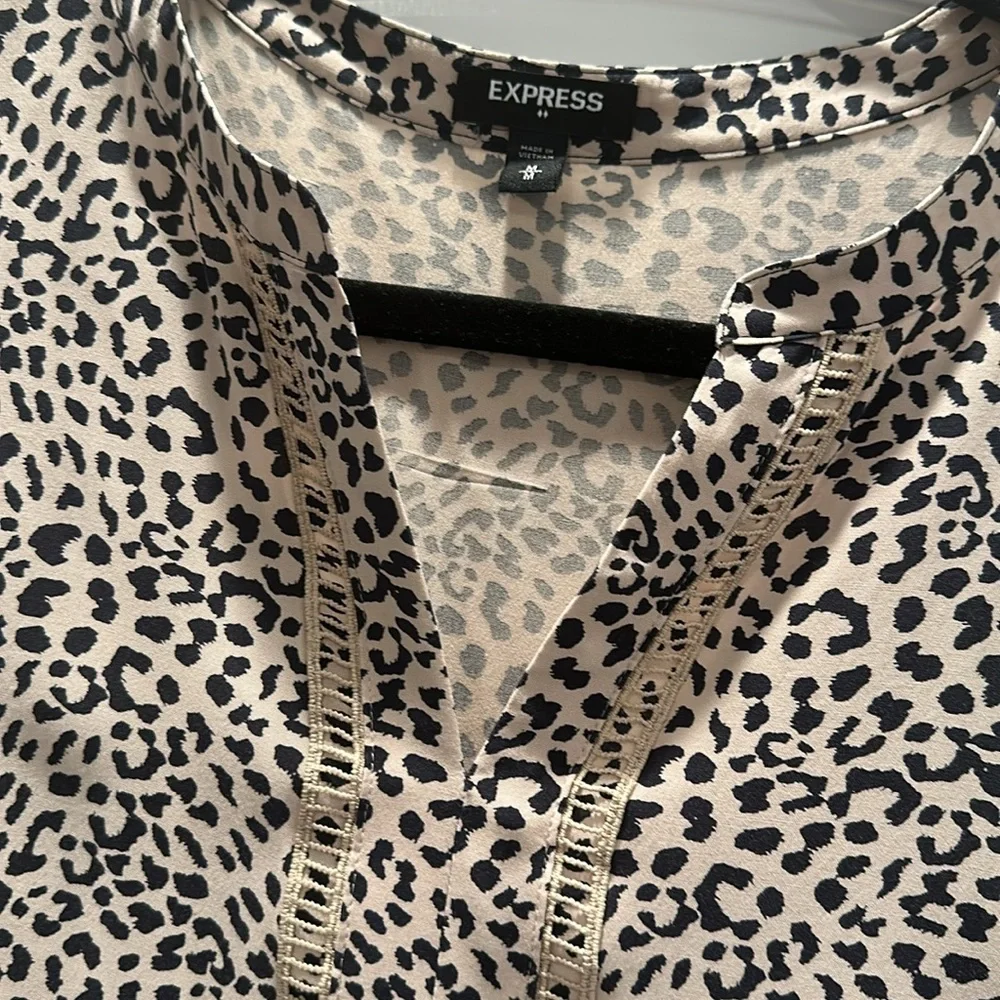 Beautiful Express 100% Rayon animal print top dry cleaned